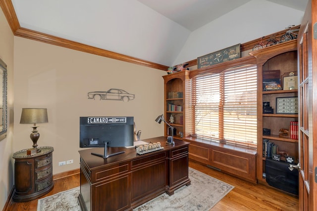 home office with light wood-type flooring, lofted ceiling, and ornamental molding