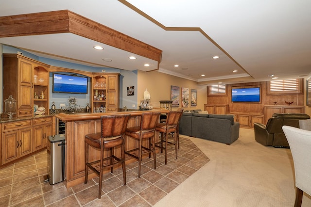 bar featuring recessed lighting, wet bar, light colored carpet, and ornamental molding