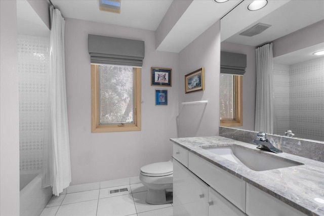 bathroom featuring tile patterned flooring, visible vents, vanity, and toilet