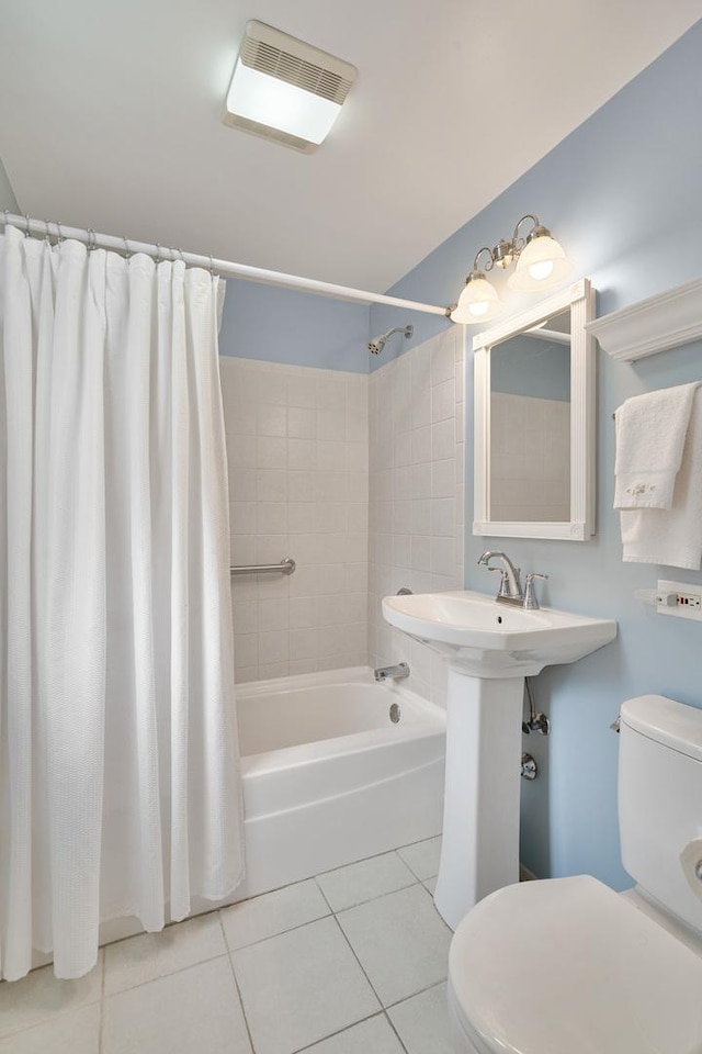 full bath featuring toilet, tile patterned flooring, shower / bathtub combination with curtain, and visible vents