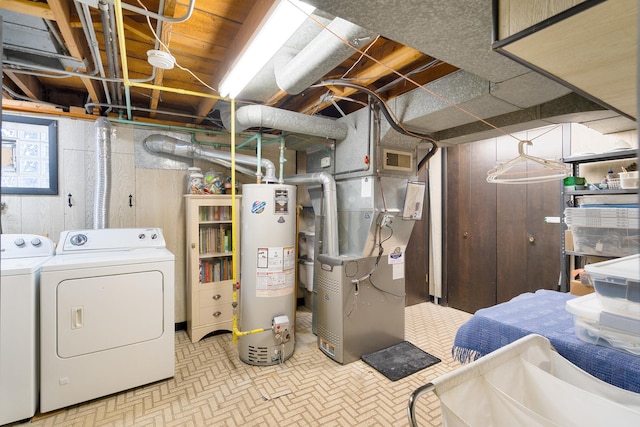 interior space featuring gas water heater, washing machine and dryer, visible vents, and heating unit