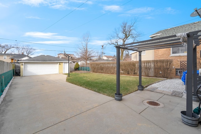 exterior space featuring a garage, fence, an outdoor structure, and a pergola