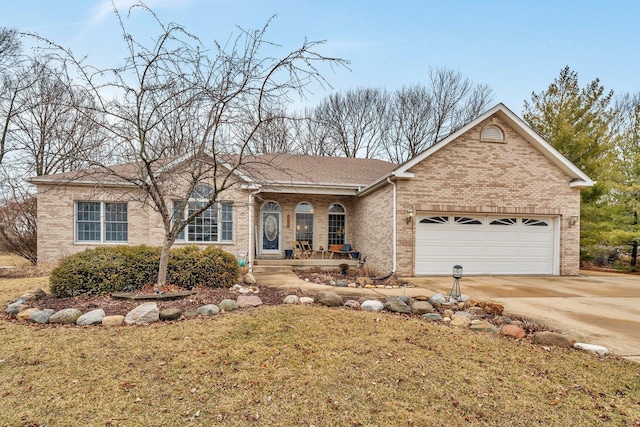 single story home with a garage, brick siding, and driveway