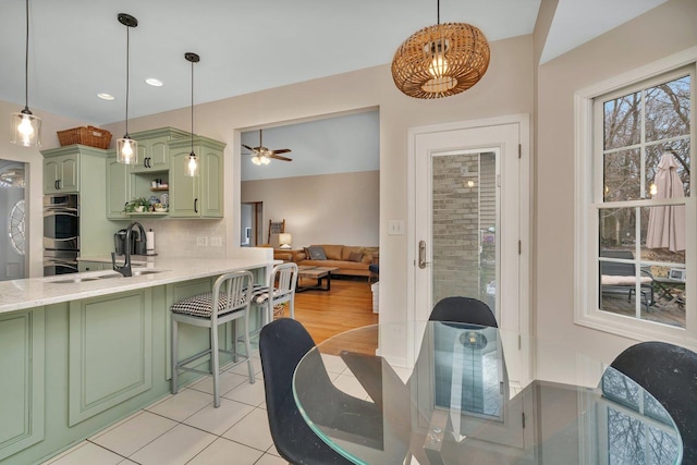 dining room featuring light tile patterned floors, ceiling fan, and recessed lighting