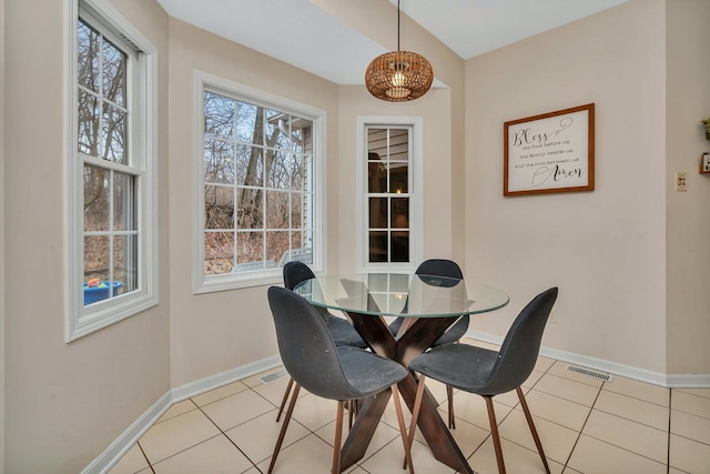 dining room with light tile patterned flooring, visible vents, and baseboards