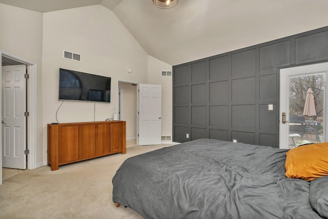 bedroom with high vaulted ceiling, visible vents, light carpet, and baseboards