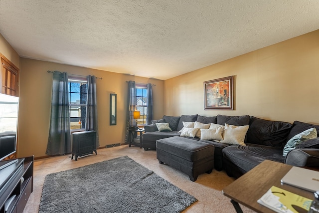 living room with light carpet, baseboards, visible vents, and a textured ceiling