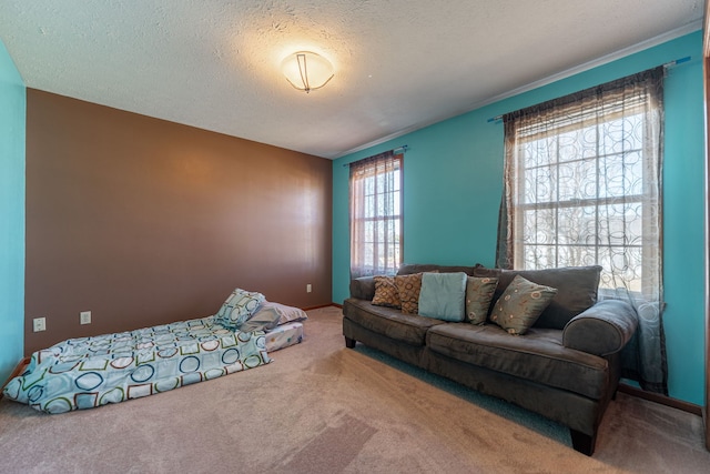 carpeted bedroom featuring a textured ceiling