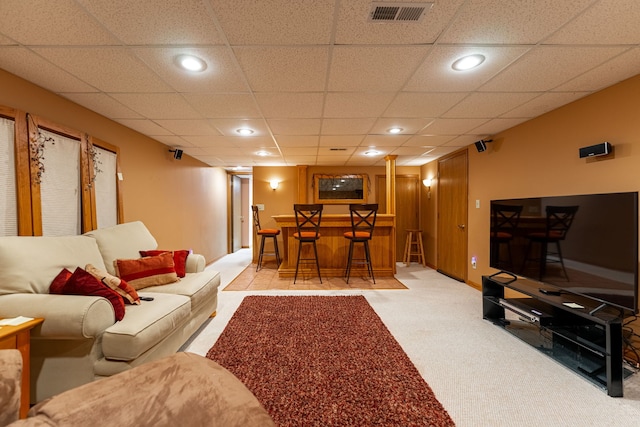 living room with a dry bar, light carpet, visible vents, a paneled ceiling, and recessed lighting