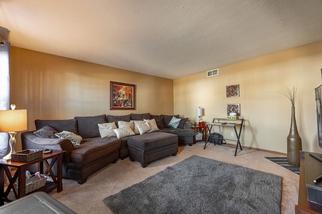 carpeted living area with baseboards, visible vents, and a textured ceiling