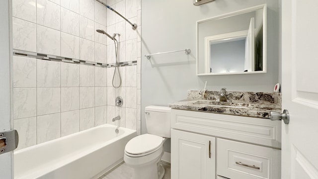 bathroom featuring shower / bathing tub combination, vanity, and toilet