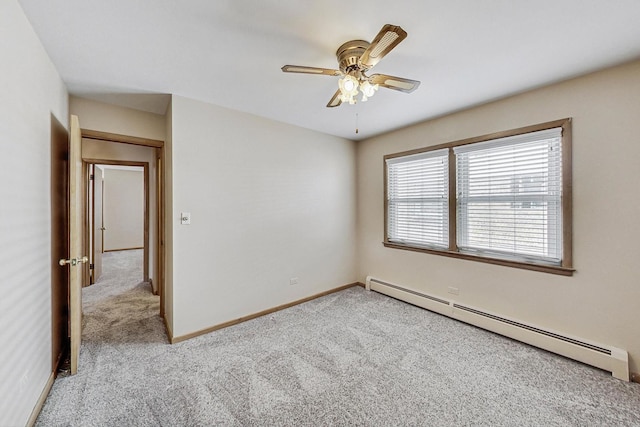 empty room featuring light carpet, ceiling fan, baseboards, and baseboard heating