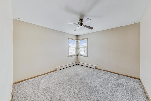 carpeted spare room featuring baseboards, baseboard heating, and a ceiling fan