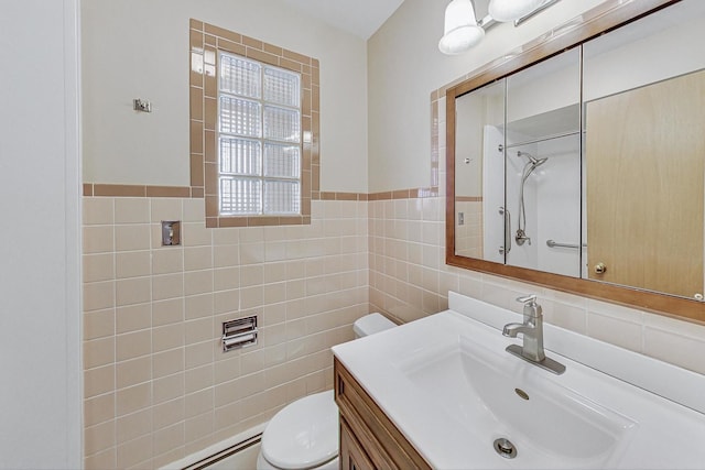 bathroom with walk in shower, vanity, toilet, and tile walls