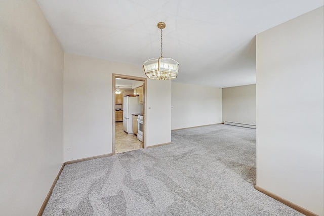 spare room with light carpet, an inviting chandelier, a baseboard radiator, and baseboards