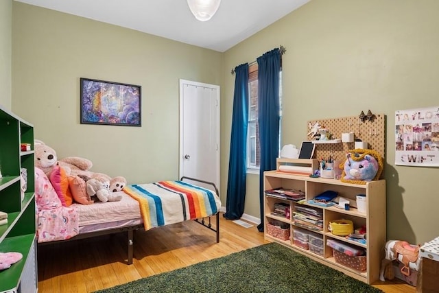 bedroom featuring wood finished floors