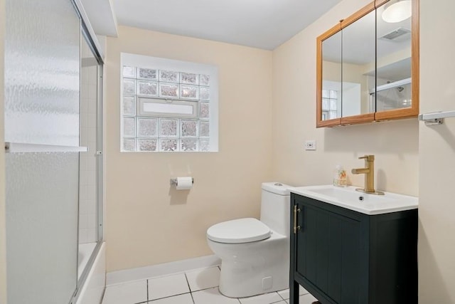bathroom with visible vents, baseboards, toilet, vanity, and tile patterned flooring
