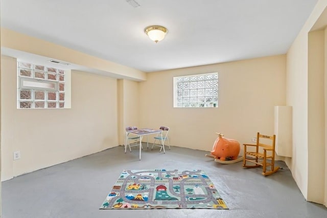 playroom featuring visible vents and concrete flooring
