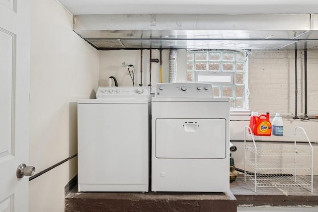 laundry room with washer and clothes dryer and laundry area