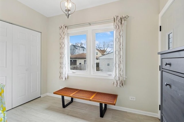 interior space with baseboards and wood finished floors