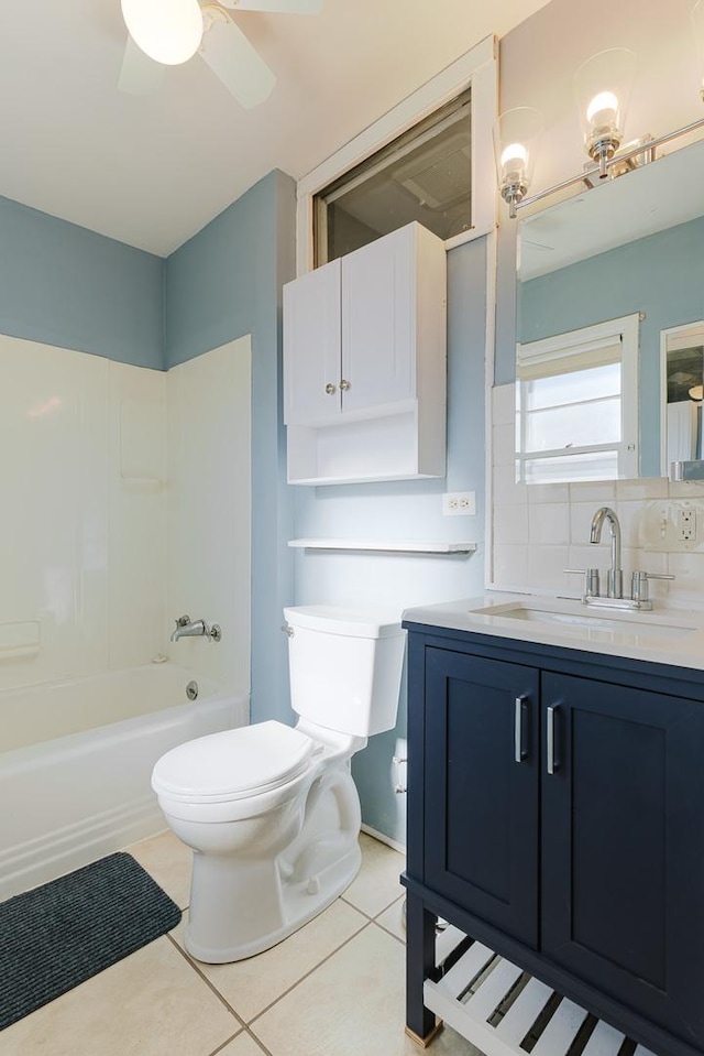 full bath featuring toilet, shower / tub combination, ceiling fan, tile patterned floors, and vanity