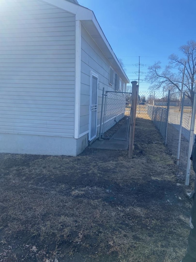 view of side of home with fence