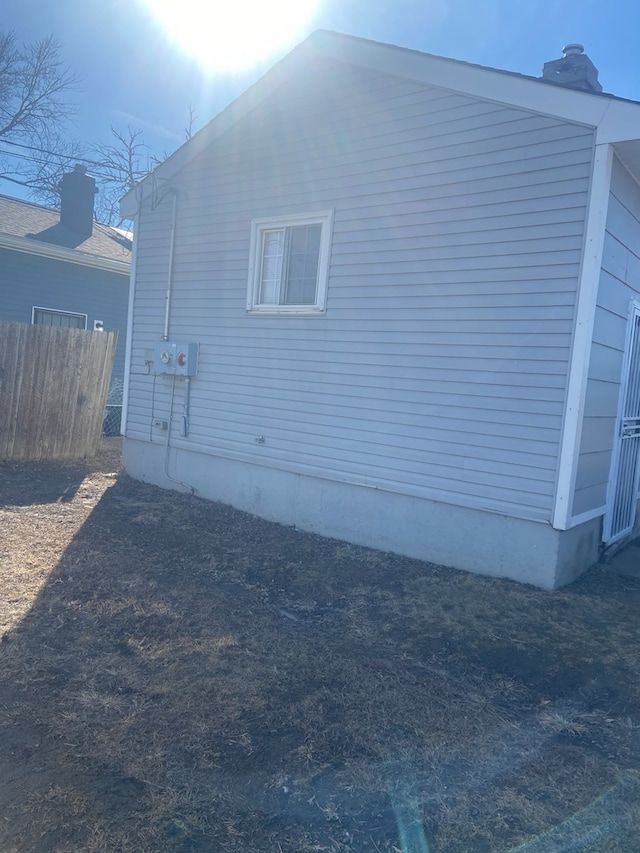 view of side of property with fence