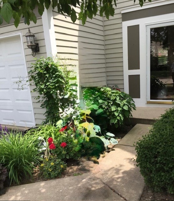 doorway to property with a garage