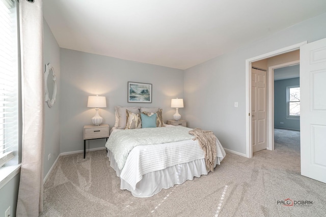 bedroom featuring baseboards and carpet flooring