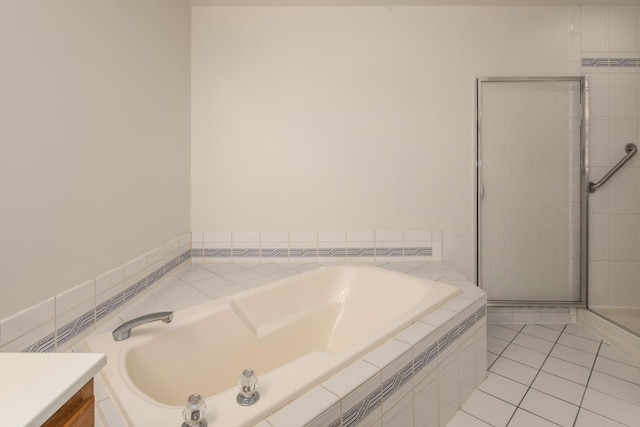 full bath with a stall shower, a garden tub, vanity, and tile patterned floors