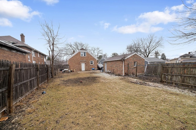 view of yard with a fenced backyard