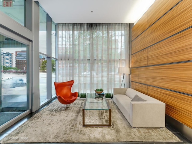 living area featuring a wall of windows