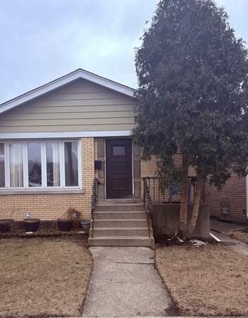 view of front of property featuring brick siding