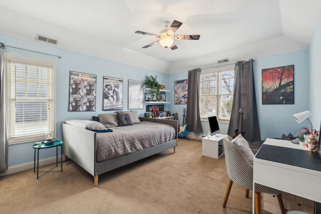 bedroom with light colored carpet, visible vents, ceiling fan, and baseboards