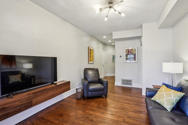 living room with recessed lighting, wood finished floors, visible vents, and baseboards