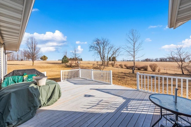 wooden deck featuring a rural view