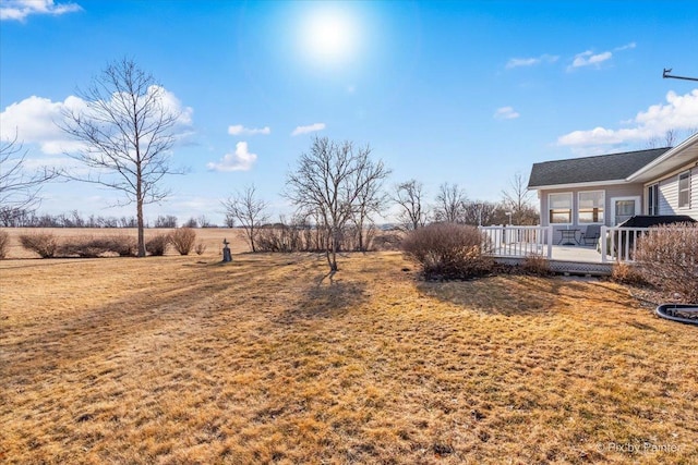 view of yard with a deck