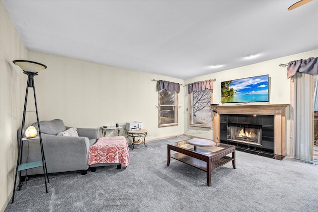 carpeted living area with a fireplace