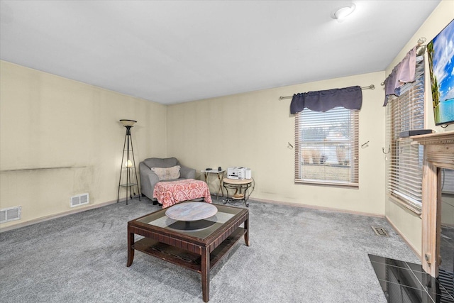 sitting room featuring carpet, visible vents, and baseboards