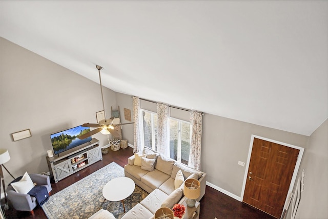 living room featuring lofted ceiling, wood finished floors, a ceiling fan, and baseboards