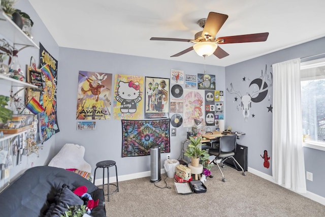 recreation room featuring carpet, baseboards, and a ceiling fan