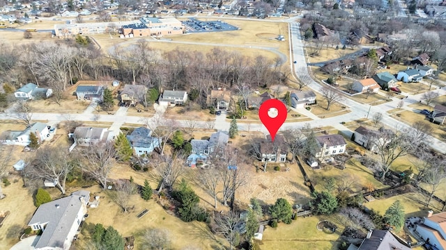 birds eye view of property with a residential view