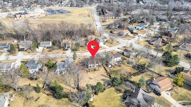 birds eye view of property with a residential view