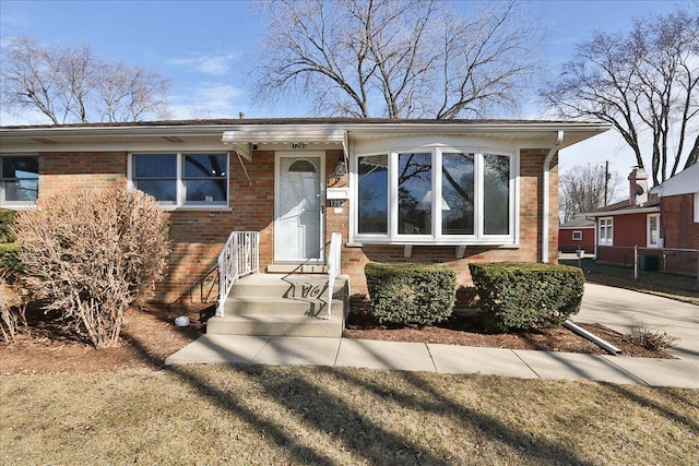 view of front of house featuring brick siding