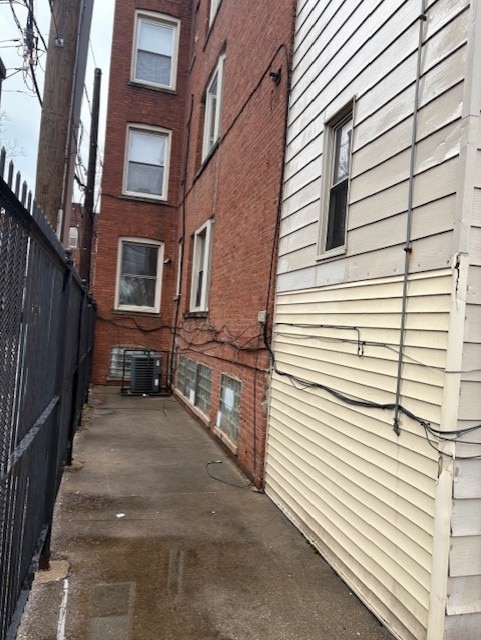 1519 E 68th St Unit 1, Chicago, IL 60637 - view of home's exterior featuring brick siding and a patio