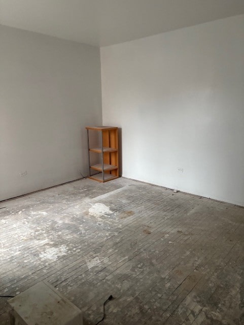 spare room featuring hardwood / wood-style floors