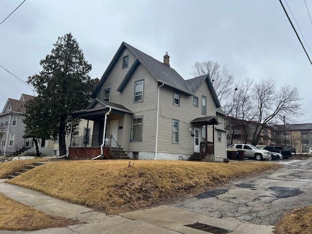 view of side of home with a chimney