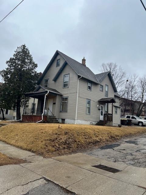 view of property exterior featuring a chimney