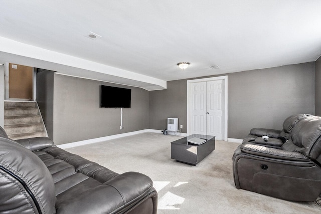 living room with visible vents, light colored carpet, stairway, and baseboards