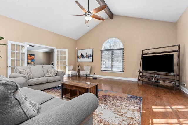 living room with ceiling fan, wood finished floors, baseboards, french doors, and beamed ceiling